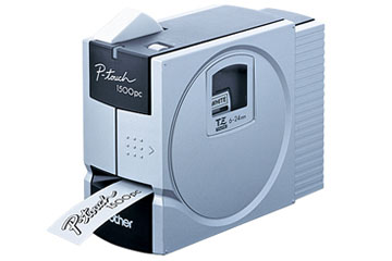 Brother P-touch PT-1500PC desktop label printer, with cassette bay and a printed tape exiting the front