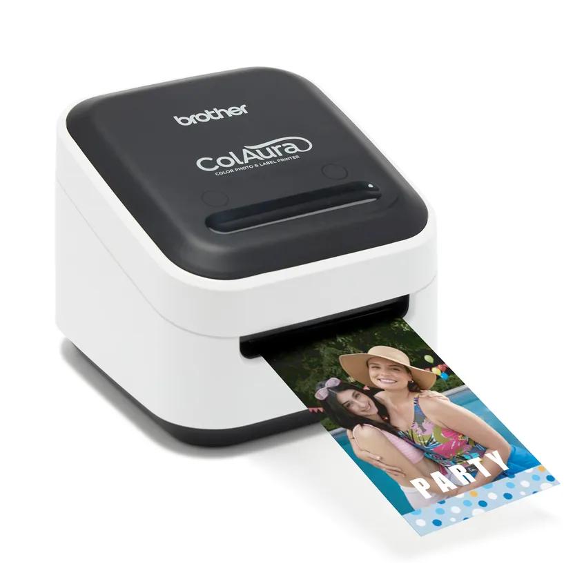 Brother VC-500W ColAura black-and-white color label printer with a color roll emerging from the output slot